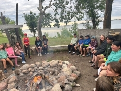 kids sitting around a campfire
